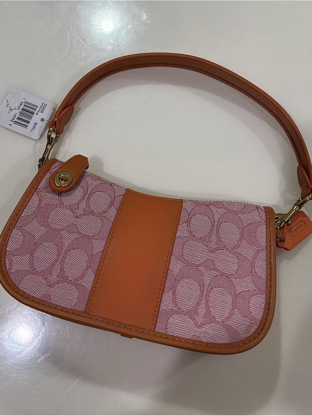 Coach Swinger 20 orange Signature Canvas Mini Bag with Tan Leather Trim